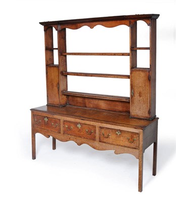 Lot 1477 - A George III Oak and Mahogany Open High Dresser and Rack, circa 1800, the rack of breakfront...