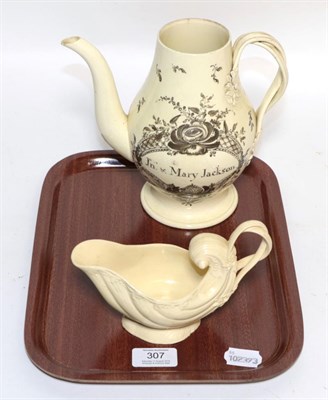 Lot 307 - A 19th century creamware shallow form sauce boat, together with a later creamware teapot...