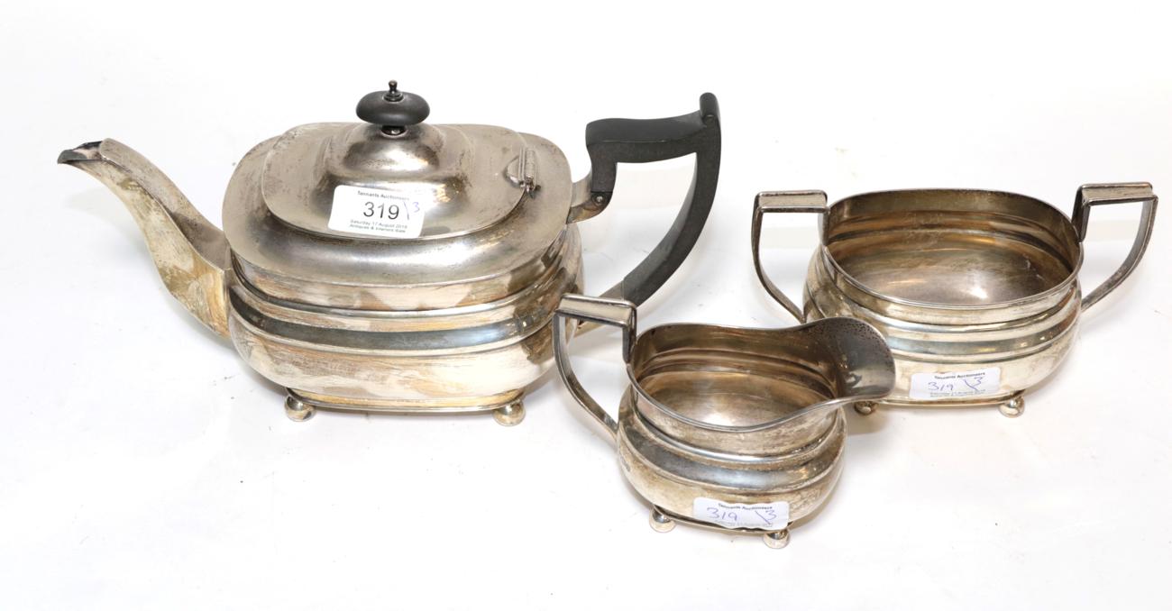 Lot 319 - A George VI three-piece silver tea-service, by William Hutton and Sons, Sheffield, 1937, each piece