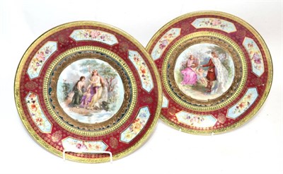 Lot 323 - A pair of gilt and floral decorated Vienna plates with central painted Shakespearian scenes...