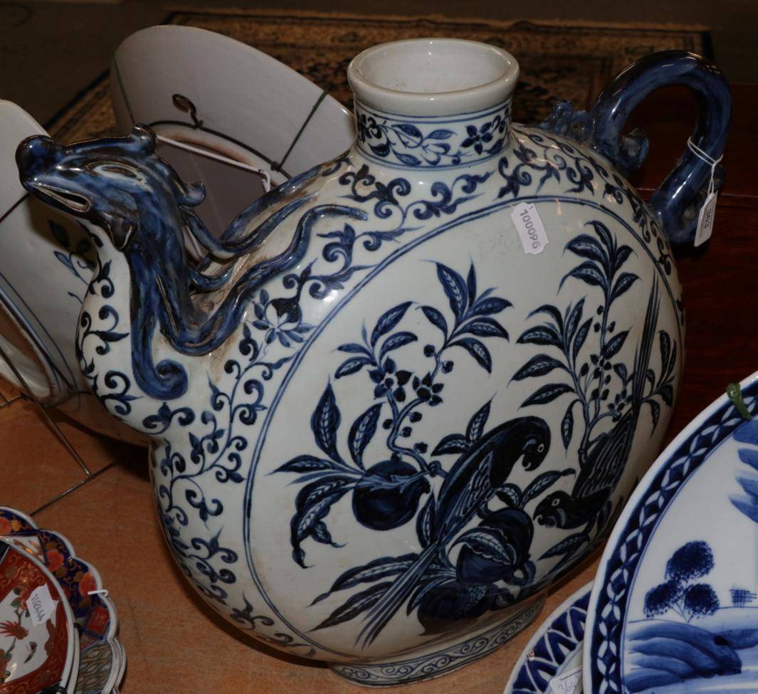 Lot 363 - A large Chinese blue and white moon form ewer, hand painted with parrots, 44cm height