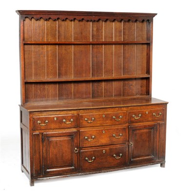 Lot 1485 - A George II Joined Oak Enclosed High Dresser and Rack, mid 18th century, the upper section with...