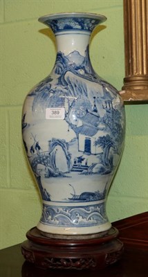 Lot 389 - A 19th century Chinese blue and white baluster vase decorated with figures amongst a...