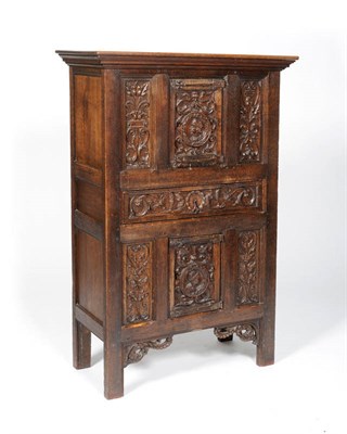 Lot 1490 - A Joined Oak Cupboard, in the Renaissance style, with two carved strapwork panels around a...