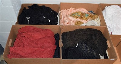 Lot 1025 - Four boxes of assorted evening scarves, black lace stoles, black silk top, underskirts etc