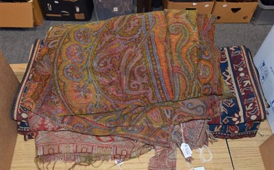 Lot 1034 - Two 19th century paisley shawls; and two 20th century machine woven pelmets (4)