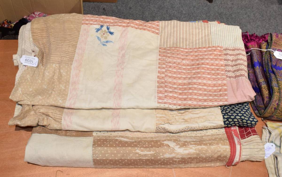 Lot 1039 - 19th Century patchwork quilt with central square enclosing red and white alternating patches...