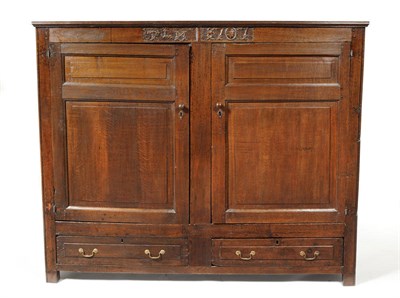 Lot 1493 - A Joined Oak Cupboard, basically 18th century, the frieze carved with initials TLM and dated...