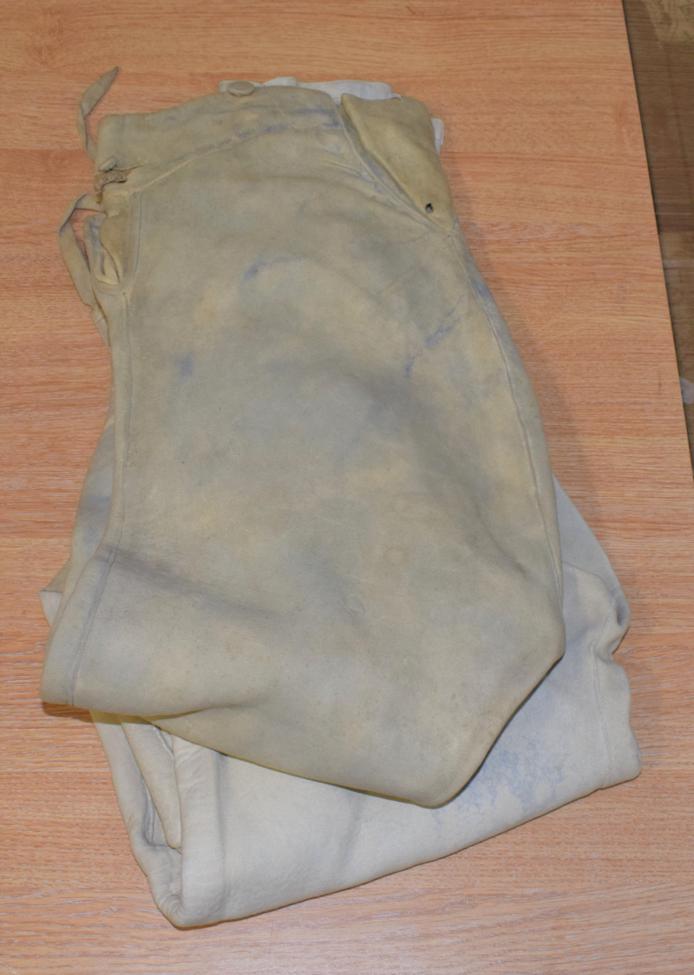 Lot 1058 - Two 18th century pairs of buckskin fall front breeches, (a.f.)