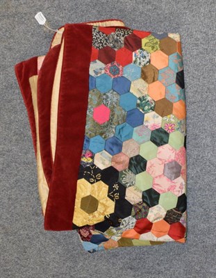 Lot 1061 - Mid 20th century patchwork cover, comprising hexagonal patched flower heads, within a border of red