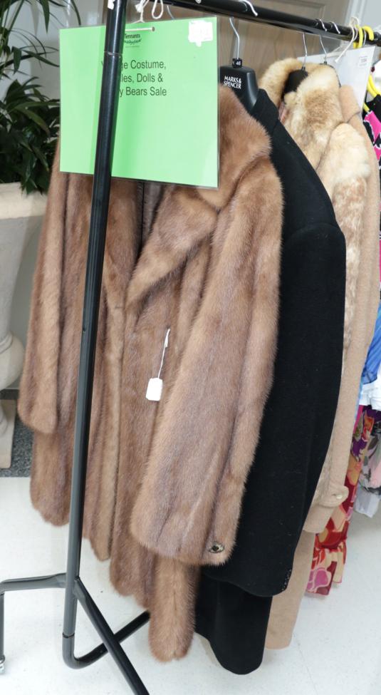 Lot 1093 - A Dyson's Leeds pastel mink coat, another in light brown coney fur, Rodex camel coloured...