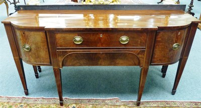 Lot 1508 - A George III Mahogany and Boxwood Strung Breakfront Sideboard, circa 1790, the top formerly...