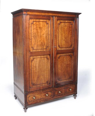 Lot 1511 - A George III Mahogany Linen Press, early 19th century, the reeded breakfront pediment above a plain