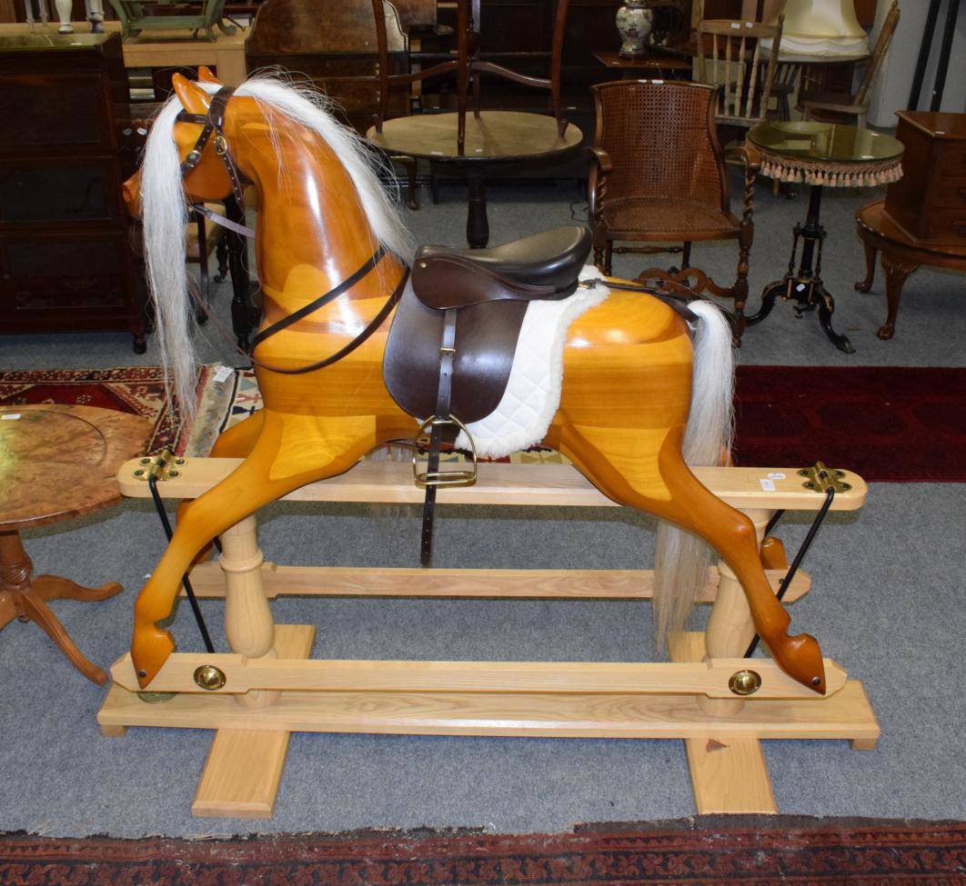 Lot 1308 - A modern rocking horse, the base with metal plaque stamped Rocking Horse Makers and Restorers York