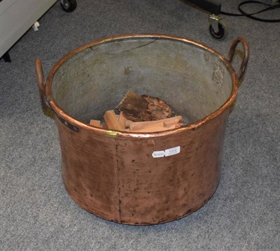 Lot 1312 - A large twin handled copper log bin, 34.5cm high by 52cm diameter