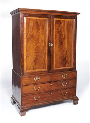 Lot 1513 - A George III Mahogany and Satinwood Banded Linen Press, 1st quarter 19th century, the dentil...