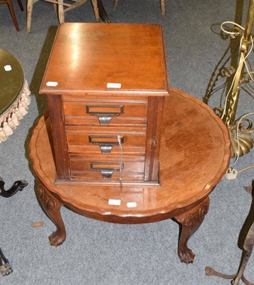 Lot 1324 - A walnut three drawer Wellington type filing chest; and a walnut coffee table with piecrust border