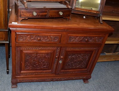 Lot 1340 - A 20th century Chinese hardwood sideboard, with two drawers above two cupboard doors