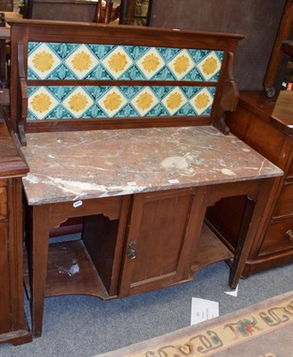 Lot 1345 - A Victorian wash stand with floral decorated tiles and marble top