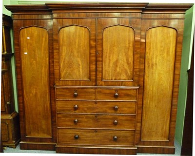 Lot 1518 - A Victorian Mahogany Breakfront Wardrobe, 3rd quarter 19th century, the cavetto cornice above a...