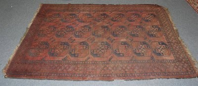 Lot 1366 - An Ersari carpet, the madder field of elephant foot guls enclosed by stepped diamond medallion...