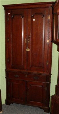 Lot 1382 - A George III oak standing corner cupboard