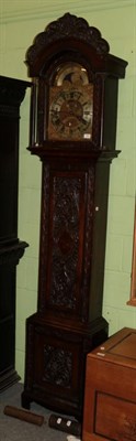 Lot 1386 - An eight day longcase clock signed Wm Sproston Trelleck, moonphase dial, later oak carved case