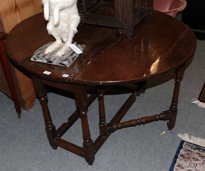 Lot 1391 - An 18th century and later oak gateleg table