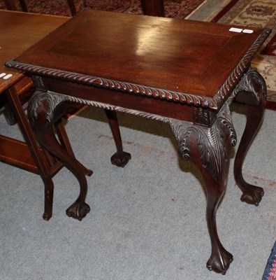 Lot 1412 - A George III style carved mahogany side table with drawer, on claw and ball feet