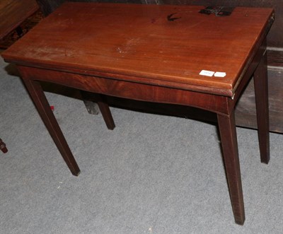 Lot 1414 - A 19th century mahogany fold over tea table