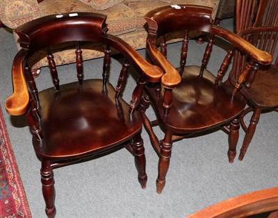 Lot 1425 - A pair of smokers bow armchairs