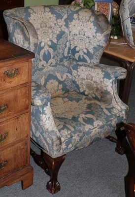 Lot 1430 - A 19th century wingback armchair, ball and claw feet