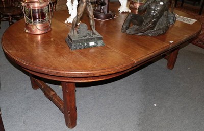 Lot 1433 - A late Victorian oak extending table by James Rodwell, with two additional leaves, raised on square