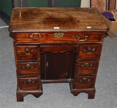 Lot 1435 - A George III mahogany kneehole desk