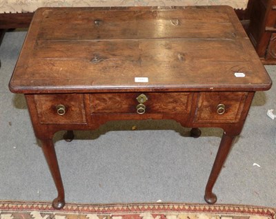 Lot 1445 - An 18th century walnut lowboy