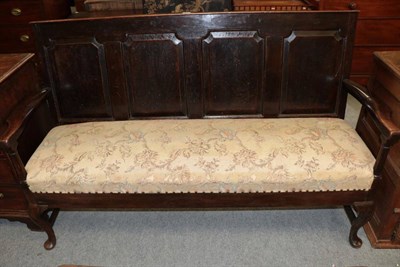 Lot 1449 - A George III oak settle