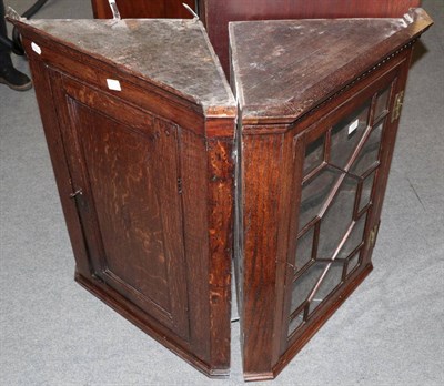 Lot 1452 - An oak glazed corner cupboard; and an early 19th century corner cupboard (2)