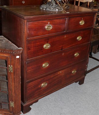 Lot 1453 - An early 19th century mahogany four-height chest of drawers