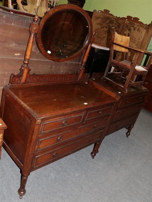 Lot 1475 - An early 20th century mirror backed dressing table; and a matching three height oak chest of...