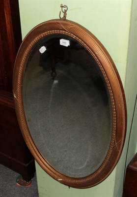 Lot 1485 - A gilt oval shaped wall mirror