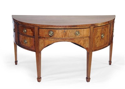 Lot 1531 - A George III Mahogany and Boxwood Strung Demi-Lune Sideboard, circa 1800, the bowfront frieze...