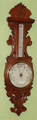 Lot 1513 - An oak cased aneroid barometer