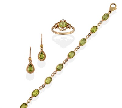Lot 2003 - A Peridot and Seed Pearl Bracelet, the stones in crimped settings alternate along the length of the