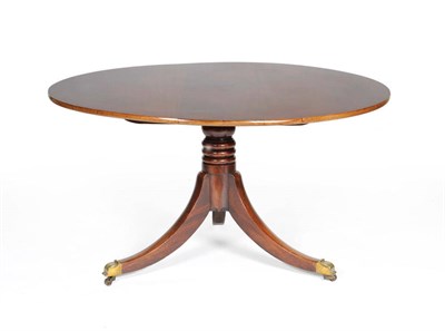 Lot 1533 - A Mahogany Breakfast Table, 19th century with alterations, the circular top with platform base...