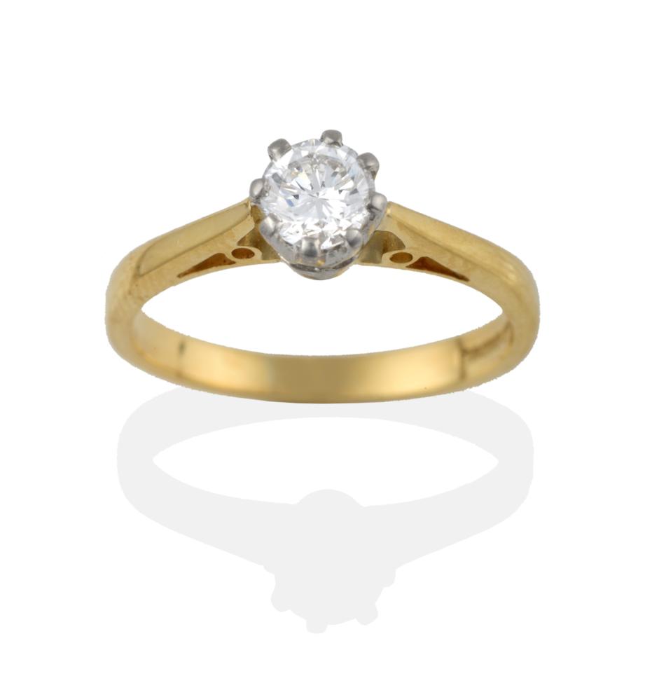 Lot 2006 - An 18 Carat Gold Diamond Solitaire Ring, the round brilliant cut diamond in a white claw setting to