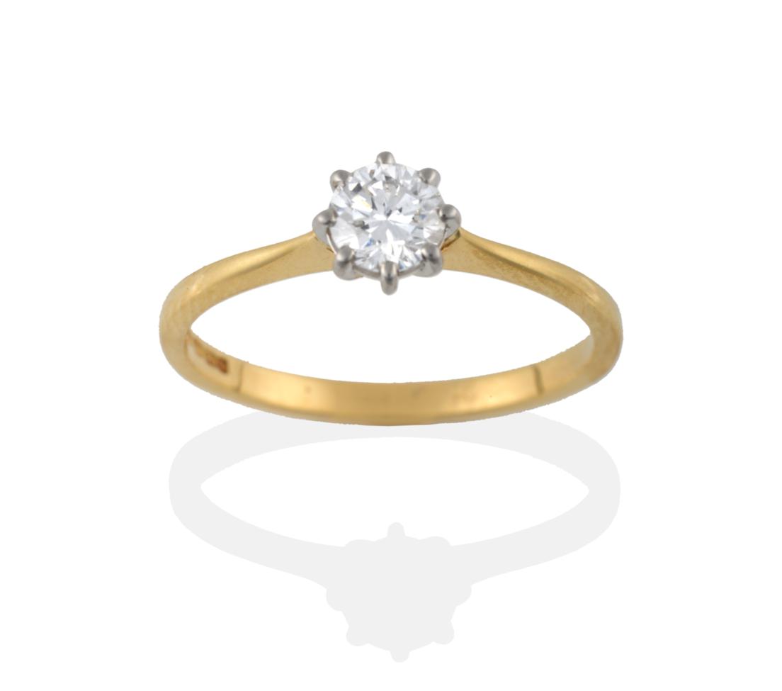 Lot 2008 - An 18 Carat Gold Diamond Solitaire Ring, the round brilliant cut diamond in a white claw setting to