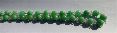Lot 2009 - A Jade and Rock Crystal Necklace, spherical jade beads spaced by faceted and smooth rock...