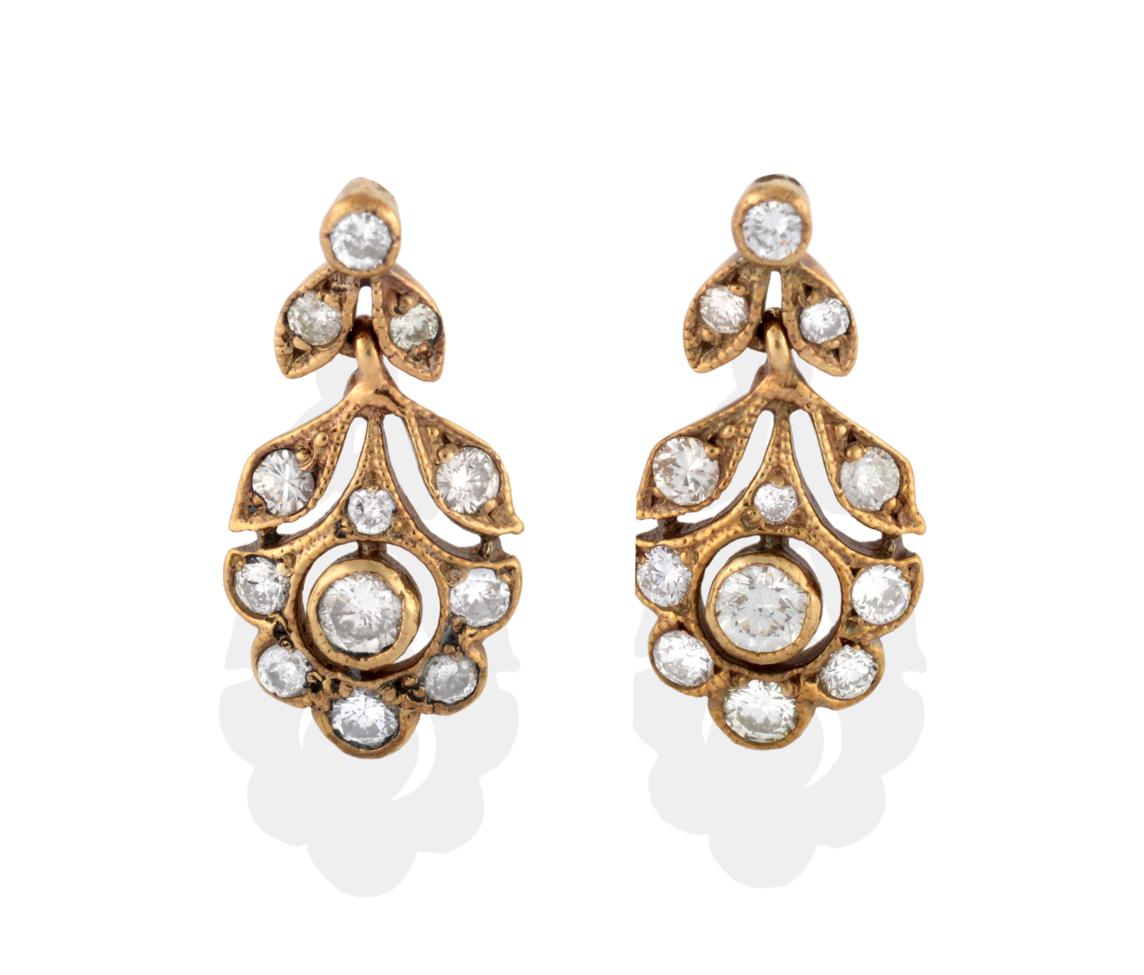 Lot 2010 - A Pair of Floral Drop Earrings, the floral and foliate drops of pierced mounts inset with round...