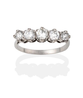 Lot 2016 - A Diamond Five Stone Ring, the graduated round brilliant cut diamonds in white claw settings to...