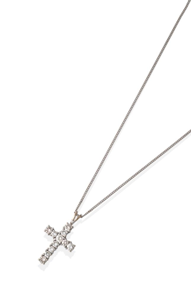 Lot 2017 - A Diamond Cross Pendant on Chain, set throughout with round brilliant cut diamonds, in white...
